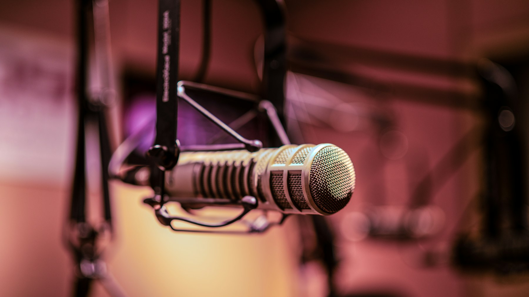 A vintage microphone on a stand in a radio recording studio